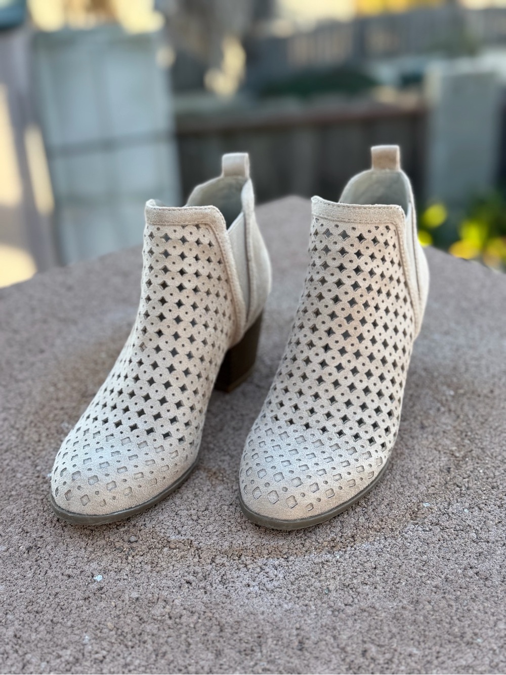 Indigo Perforated Suede Ankle Booties in Beige